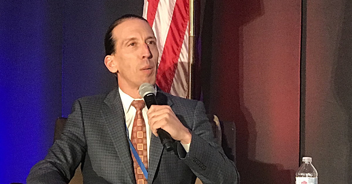 Photo of Dr. John Espinola speaking at the 2018 Washington State of Reform Health Policy Conference