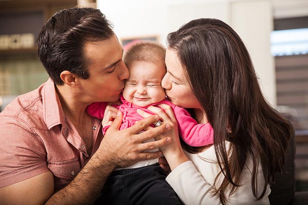 couple kissing baby couple kissing baby