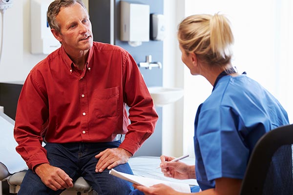 preventive health man speaking with doctor