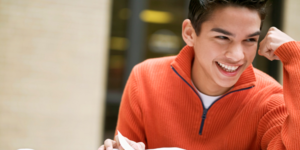 teenager-in-orange-sweater